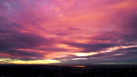 Dramatic-Sky-During-Sunset-Over-The-City---Dusk-to-Night---Timelapse