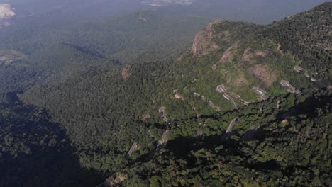 Revealing-Shot-of-Yercaud's-Hairpin-Bends-in-the-Middle-of-the-forest-in-the-Mountain-During-a-Sunny-Day