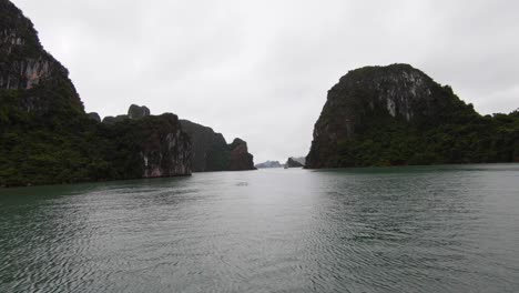 Cruising-along-Ha-Long-Bay-amongst-towering-limestone-islands