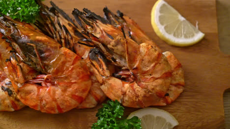 grilled-tiger-prawns-or-shrimps-with-lemon-on-wood-board