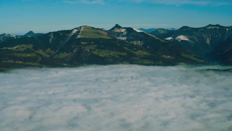 4K-UHD-time-lapse-cinemagraph-of-moving-fog-clouds-bove-Austria-and-Bavaria,-seen-from-Berchtesgaden-'s-famous-Rossfeld-Panorama-Road-in-winter