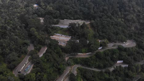 Aerial-shot-of-endless-vast-forest-with-trees-growing-on-the-hairpin-bends-Yercaud,-India