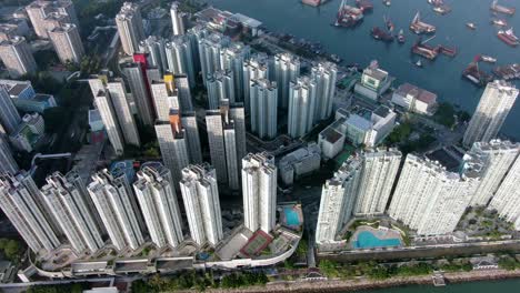 Hong-Kong-Butterfly-beach-area-skyscrapers-and-Ocean-walk,-low-angle-aerial-view