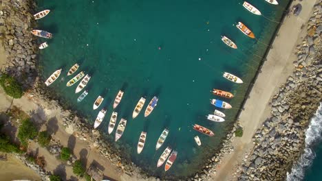 From-the-top-view-of-a-group-of-small-fishing-boats-tied-in-a-small-marina