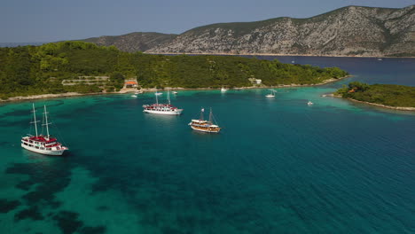 Tour-boat-experience,-exploring-beautiful-Croatian-Adriatic-Sea-coast,-aerial