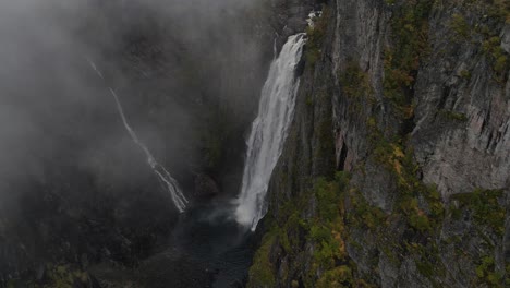 Zooming-out-drone-footage-of-Vøringfossen-waterfall-in-Western-Norway-in-Autumn