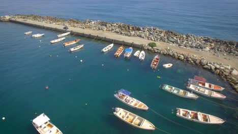 Aerial-shot-of-a-small-fishing-boats-marina-in-the-Caribbean-Sea