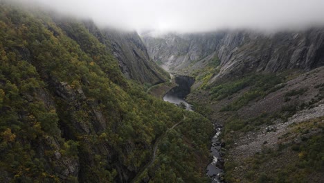 Beautiful-view-of-a-valley-in-Western-Norway-with-low-clouds-river