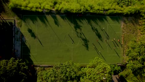 Aerial-view-of-a-soccer-game-and-field-during-a-golden-hour,-in-Caracas,-Venezuela