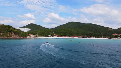 4k-drone-footage-of-a-jet-skier-crushing-the-waves-of-the-beautiful-coastline-of-Ko-Larn-island-in-Thailand