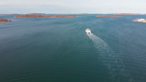 Daytime-drone-view-of-the-Hingham-MBTA-commuter-ferry-boat-navigating-the-channel
