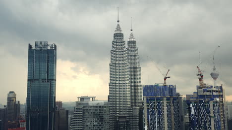 Drone-shot-of-Petronas-Twin-Towers,-Four-Seasons-Place-and-Star-Residences,-Kuala-Lumpur