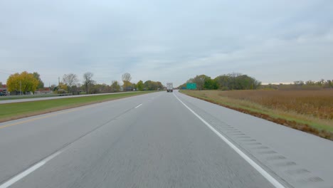 POV-while-driving-on-Interstate-I280-near-the-exchange-for-Interstate-I74-and-the-Quad-Cities-Airport-in-late-Fall-on-a-cloudy-day-near-Moline-Illinois