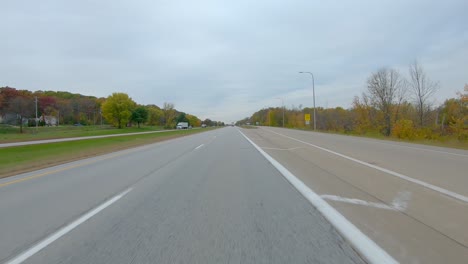 POV-while-driving-on-Interstate-I280-near-the-exchange-for-the-Weigh-Station-in-late-Fall-on-a-cloudy-day-near-Moline-Illinois