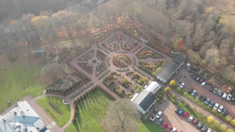 Aerial-pull-back-over-large-mansion-house-formal-gardens
