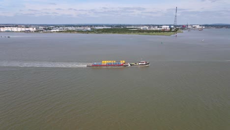 Cargo-Ship-Vessel-Transporting-Shipping-Containers-in-UK,-Aerial
