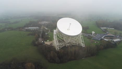 Aerial-Jodrell-bank-observatory-Lovell-telescope-misty-rural-countryside-high-orbit-right