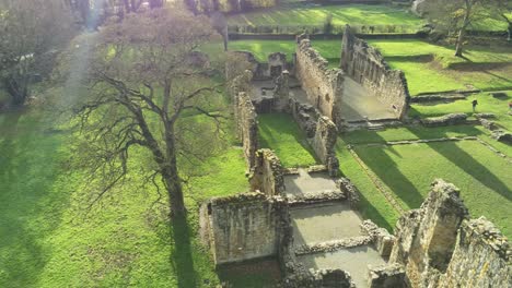 Basingwerk-abbey-landmark-medieval-abandoned-Welsh-ruins-Aerial-view-birdseye-slow-left