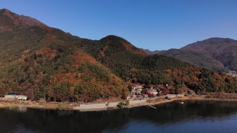 Slow-rotating-drone-aerial-over-beautiful-mountains-and-hills-in-autumn-colors