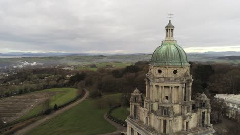 Aerial-view-landmark-historical-copper-dome-building-Ashton-Memorial-English-countryside-close-to-pull-back-rising