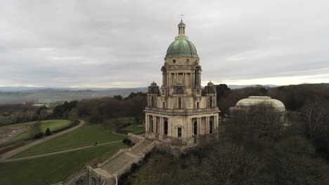 Aerial-view-landmark-historical-copper-dome-building-Ashton-Memorial-English-countryside-mid-orbit-left