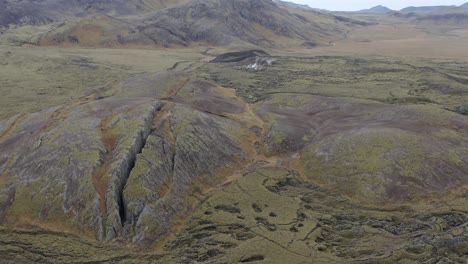 Amazing-volcanic-landscape-at-famous-fissure-Lambafell-in-Iceland,-aerial