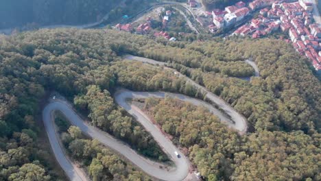 Aerial-View-Of-Zigzag-Forest-Roads-In-Bartin-With-Vehicles-During-Day-Time-In-Black-Sea-Region,-Turkey---Static-Shot