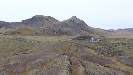 Popular-tourist-attraction-fissure-Lambafellsgjá-in-scenic-terrain-of-Iceland