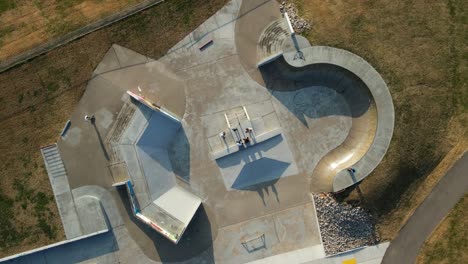 Skateboarders-converge-for-conversation-in-the-middle-of-a-skate-park