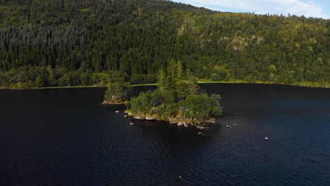 Aerial-view-of-a-little-island-in-a-lake-4K