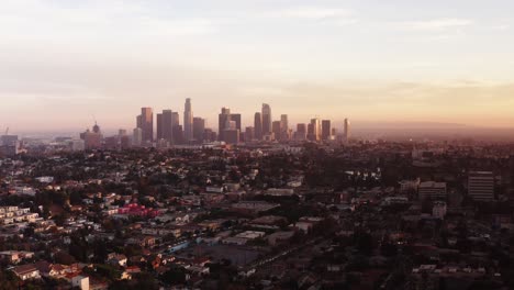 Low-aerial-shot-of-Downtown-Los-Angeles-at-sunset