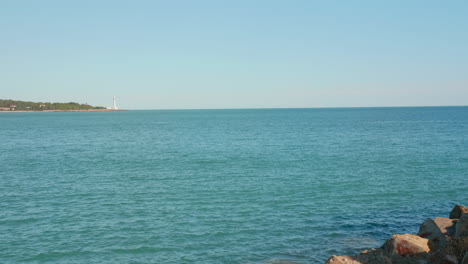 Seascape-with-a-lighthouse-in-the-distance