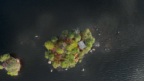 Aerial-view-of-a-little-island-in-a-lake-4K