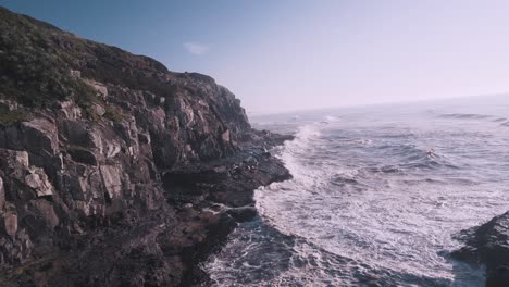 Waves-crashing-on-cliffs-of-the-atlantic-ocean-at-sunrise