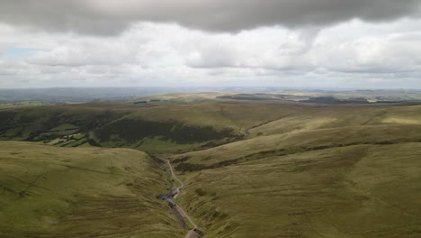 Llyn-y-Fach-idyllic-Brecon-beacons-trekking-valley-overcast-countryside-wilderness-aerial-view-landscape