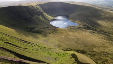Llyn-y-fan-Fach-Brecon-beacons-perfection-Wales-mountain-valley-countryside-lake-wilderness-Aerial-wide-orbit-right