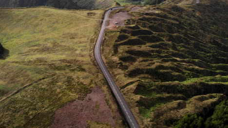 Roadway-to-crater-Azores-island-Sao-Miguel-aerial-reveal-pan