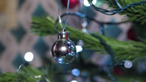 The-Christmas-artificial-Christmas-tree-rotates-with-lights,-Christmas-lights