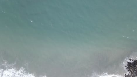 Aerial-view-of-ocean-waves-at-beach
