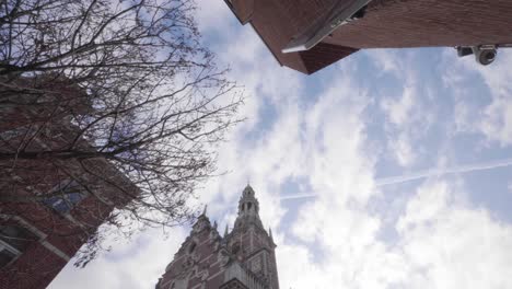 Low-angle-shot-of-the-bell-tower-of-the-central-library-of-the-Catholic-University,-Leuven,-Belgium