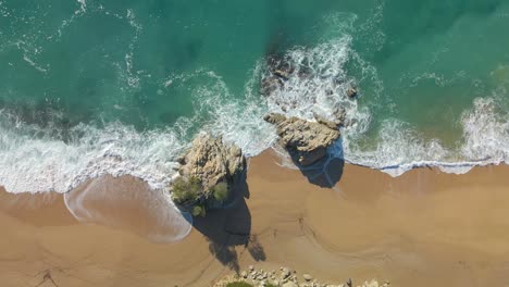 aerial-image-with-drone-of-lloret-de-mar-virgin-beach-with-green-vegetation-in-mediterranean-sea-turquoise-water-overhead-view