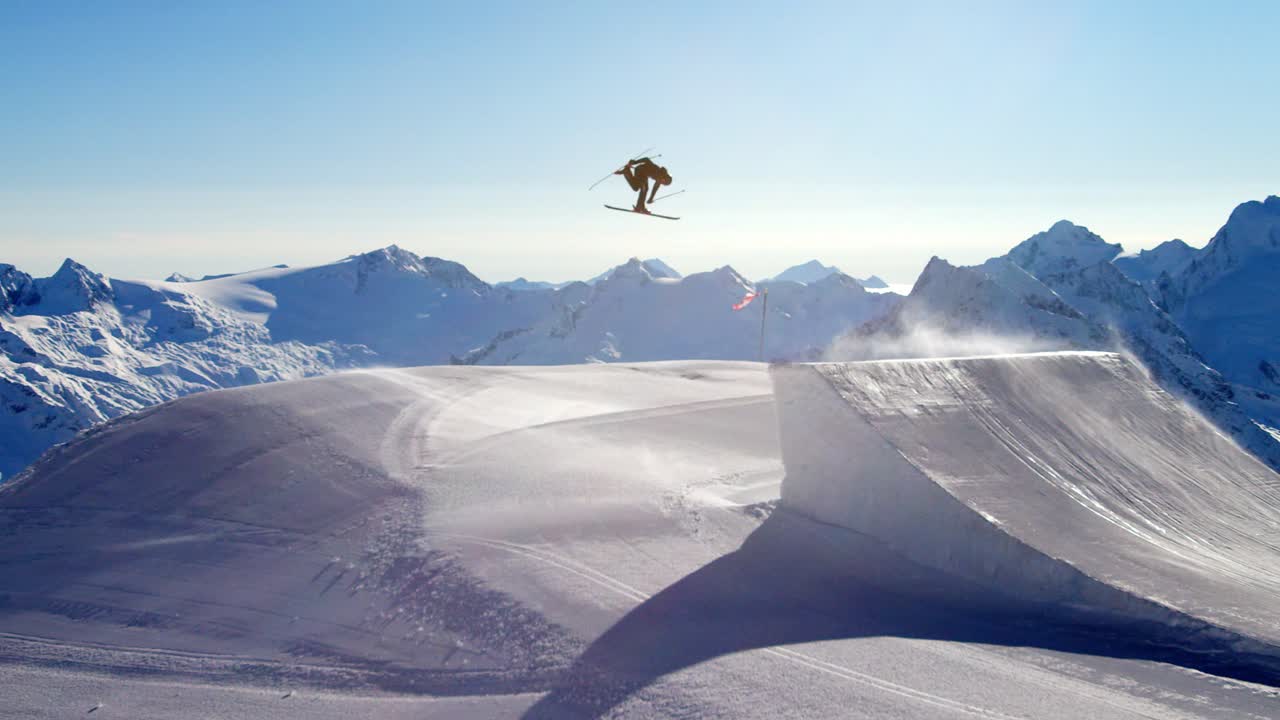 Premium stock video - Ski freestyle professional jumping on a big ski jump