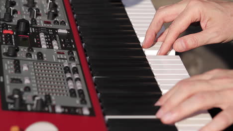 Man-Playing-Keyboard-Piano-Close-on-Hands