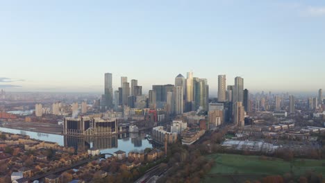 cinematic-circling-right-drone-shot-of-Canary-Wharf-skyscrapers-from-the-South-at-sunrise