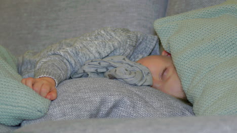 Cute-Cosy-Two-Year-Old-Boy-Sleeping-with-Clothes-on,-Close-Up