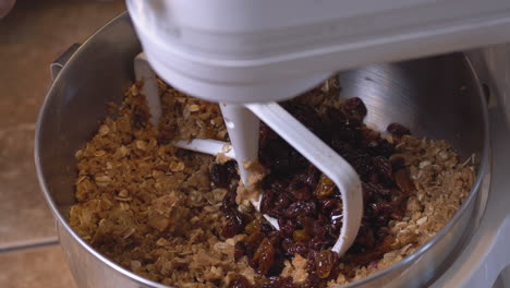 A-mixer-blending-the-dry-ingredients-for-raisin-oatmeal-cookies---isolated