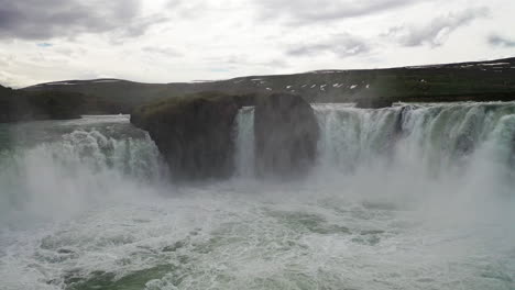 Beautiful-Godafoss-Waterfall-In-North-Iceland-During-Overcast-Day---zoom-in-drone-shot