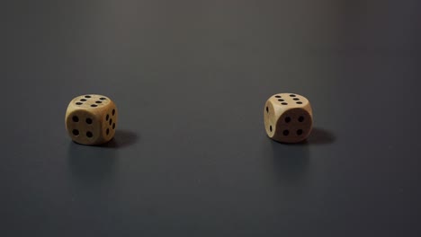 Static-closeup:-Fast-rolling-wooden-dice-ends-on-double-six