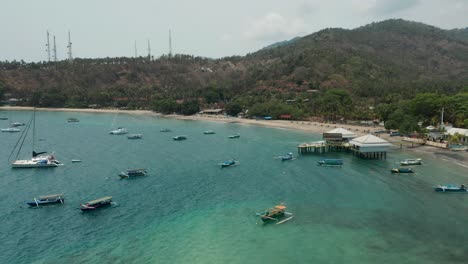 Aerial-of-Senggigi-ferry-terminal-with-boats-floating-peacefully-in-water