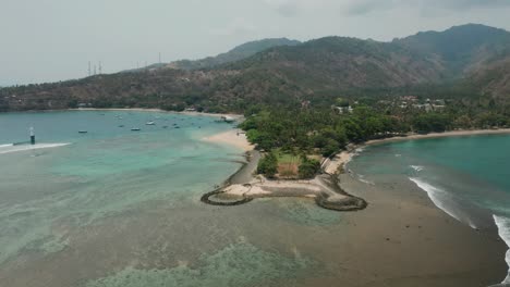 Beautiful-Tanjungan-Pantai-Senggigi-beach-during-low-tide-in-Lombok,-aerial